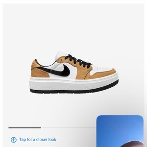 Nike air tan, white, and black.